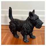 PAINTED DOG FIGURE | Small black schnauzer, black painted composition; h. 14-3/4 x w. 18-1/2 x d. 8 