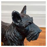 PAINTED DOG FIGURE | Small black schnauzer, black painted composition; h. 14-3/4 x w. 18-1/2 x d. 8 