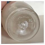 Decorative garniture set including two stem glasses and a vase each signed and numbered on the botto