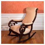 chair with a carved wood frame, upholstered seat, backrest, and arm rests; h. 39 x w. 19 x d. 37 in.