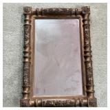 GILT CARVED MIRROR | Antique framed mirror, carved wood with foliate motifs; overall 25 x 17 in.