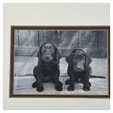 printed photograph of two black lab puppies (sight 4-1/2 x 6-1/2 in., overall 15 x 17 in.)