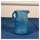 ANTIQUE BLUE GLASS PITCHER | Swirled blown blue glass with ruffled rim and rough pontil; h. 4-1/2 in