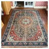 ANTIQUE MEDALLION CARPET | Having a central medallion with eight ballooning flowers, overall pattern