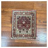 PRAYER RUG | Of small size, having a red ground with geometric devices; 28-1/2 x 25 in.