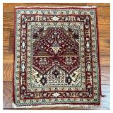 PRAYER RUG | Of small size, having a red ground with geometric devices; 28-1/2 x 25 in.