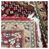 PRAYER RUG | Of small size, having a red ground with geometric devices; 28-1/2 x 25 in.