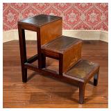 LIBRARY STEPS | Each step with inset brown leather, top step with a hidden drawer; 27 x 29 x 15-1/2 
