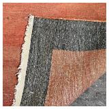 ANTIQUE RUNNER | Has a reddish field within a black-brown border, with abrash; l. 19 ft x 4ft 5 in