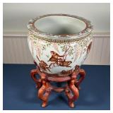 Planter decorated with monkeys playing among branches, with flowers, butterflies, and gilt highlight