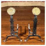 SUNFLOWER ANDIRONS | with polished brass sunflower heads on wrought irons bases; h. 24-1/2 x 13-1/2 