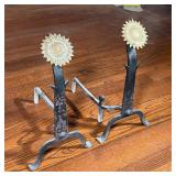 SUNFLOWER ANDIRONS | with polished brass sunflower heads on wrought irons bases; h. 24-1/2 x 13-1/2 