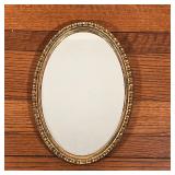 OVAL WALL MIRROR | Egg pattern gilt frame; h. 21 x 15 in.