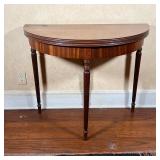 DEMILUNE GAMES TABLE | Fourth leg attached to a hidden drawer, that slides out to support the fold o