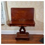 ANTIQUE LYRE FORM GAMES TABLE | Late 19th century, flip top, rotates to open on a veneered open wire