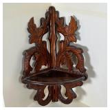 HANGING CORNER WALL SHELF | Carved wood in a leafy vine pattern; h. 17 x 8 x 8 in.