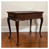 ANTIQUE SIDE TABLE | Wood side table with two pull-out writing surfaces, having a sculpted apron ove