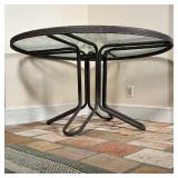 EARLY PATIO TABLE | Mottled glass top, tubular frame; h. 25 x dia. 47 in.