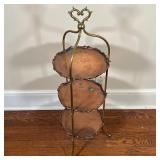 COPPER STAND | Three-tiered copper stand with scalloped edges and a heart-form carrying handle; h. 3