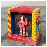 Including a mechanical dancing clown in a painted wood stage, a tin horse and carriage toy, a Joanne