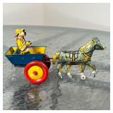 a tin horse and carriage toy, a Joanne Fox jack-in-the-box, a Corch Toys Chitty-Chitty-Bang-Bang car
