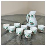 (9pc) BOEHM CHRISTMAS CHINA | With holly decoration, including 8 small teacups and an open pitcher (