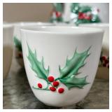 (9pc) BOEHM CHRISTMAS CHINA | With holly decoration, including 8 small teacups and an open pitcher (