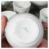 (9pc) BOEHM CHRISTMAS CHINA | With holly decoration, including 8 small teacups and an open pitcher (
