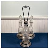 pressed glass ewer with silver plated figural handle, a cruet stand with glasses, a bell, etc. (tall