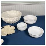 large sculpted serving or center bowl, two oval plates, 3 small bowls, and 2 leaf-form dishes; large
