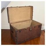 LEATHER STEAMER TRUNK | Antique steamer trunk of large size, brass bound; h. 25 x w. 39-1/2 x d. 22-