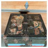 with old stickers from various destinations - very Wes Anderson!; 42 x 23 x 23 in.