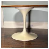 EERO SAARINEN TULIP TABLE | Tulip dining table with a wood top over a white base; h. 28-1/2 x dia. 5