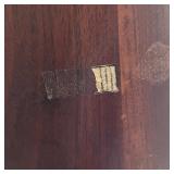 EERO SAARINEN TULIP TABLE | Tulip dining table with a wood top over a white base; h. 28-1/2 x dia. 5