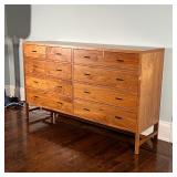 Of modern design, having two banks of two half drawers over three full-width drawers; h. 43 x w. 72 