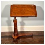 ANTIQUE WOOD EASEL | Antique easel on casters, adjustable height on a carved column; h. 45 x w. 29-1