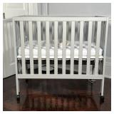 GRAY FOLDING CRIB | With mattress; h. 37 x 40 x 26 in.