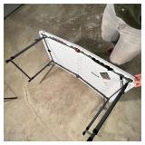 LIFETIME FOLDING TABLE | Folds in half for easy transportation, with carrying handle; folded 24 x 23
