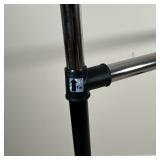 CLOTHING RACK | Black and chrome clothing rack on wheels