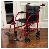 MEDLINE WHEELCHAIR | Folding wheelchair with red frame; h. 37 in.