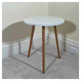 CONTEMPORARY LOW TRIPOD TABLE | White round top on wood legs; h. 20 x dia. 17 in.