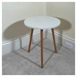 CONTEMPORARY LOW TRIPOD TABLE | White round top on wood legs; h. 20 x dia. 17 in.