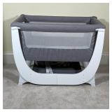 BEABA CRIB | Beaba by Shnuggle baby crib with netted sides and a pad bottom; 29 x 37 x 23 in.