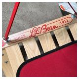 L.L. BEAN SLED | LL Bean wood sled with pull handle and red upholstered seat cushion; h. 14 x w. 38 