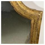 GILT BEVELED MIRROR | Beveled glass mirror in a fancy gilt frame; h. 47 x 20-1/2 in.