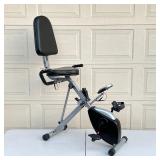 EXERCISE BIKE | Hammacher Schlemmer seated exercise bike, seat folds down for compact storage [with 