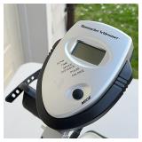 Hammacher Schlemmer seated exercise bike, seat folds down for compact storage [with loss to one peda