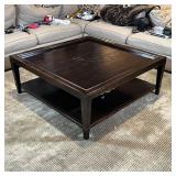 LACQUERED WOOD COFFEE TABLE | Dark wood low table with a galleried top and lower shelf; h. 18-1/2 x 