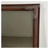 FANCY TALL MIRROR | Beveled glass wall mirror in a flower decorated frame; h. 46 x 23 in.