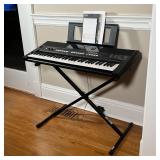 YAMAHA ELECTRIC KEYBOARD | Piano keyboard, PSR-E433, in good working condition on adjustable stand. 